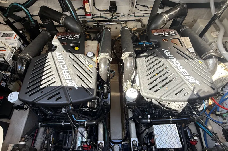 Slide: The Image of Twin Mercury engines in a 2007 Sea Ray 340 Sundancer boat engine room. - 43