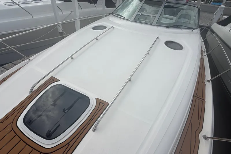 Slide: The Image of 2007 Sea Ray 340 Sundancer yacht deck with sleek design and wood accents. - 14