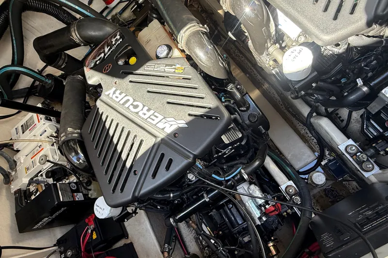 Slide: The Image of Engine compartment of a 2007 Sea Ray 340 Sundancer with Mercury components. - 44