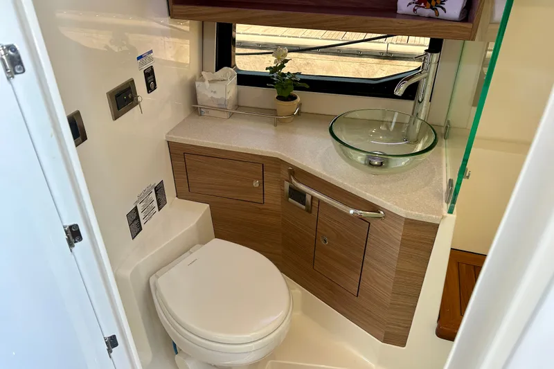 Slide: The Image of Luxurious bathroom in 2025 Boston Whaler 365 Conquest with modern fixtures and elegant design. - 13