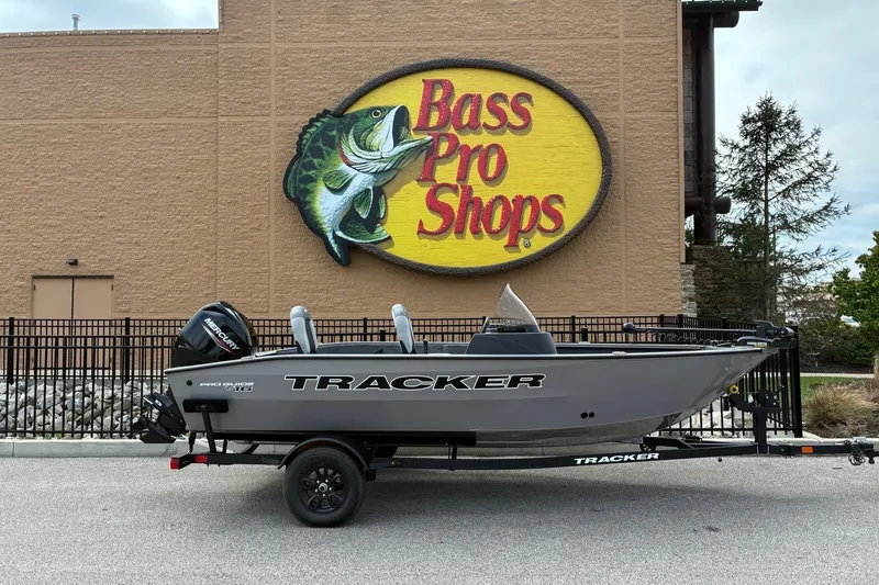 The Image of 2027 Tracker Pro Guide V-16 SC boat displayed outside Bass Pro Shops. - 0