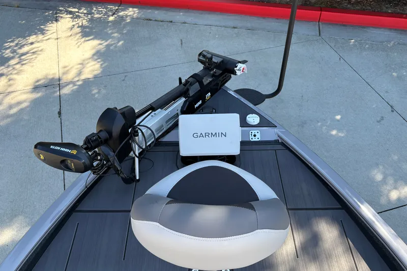 Slide: The Image of 2027 Tracker Savage 215 boat deck with Garmin electronics and Minn Kota trolling motor. - 18