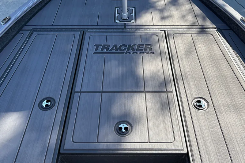Slide: The Image of Deck of 2027 Tracker Savage 215 boat with sleek design and logo. - 24