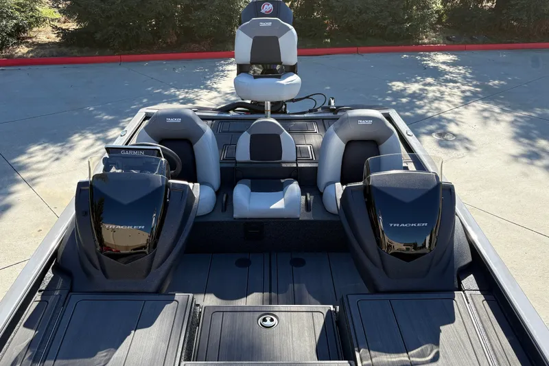 Slide: The Image of 2027 Tracker Savage 215 boat interior with dual consoles and seating. - 21