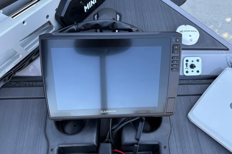 Slide: The Image of Garmin display on 2027 Tracker Savage 215 boat dashboard with Minn Kota controls. - 27