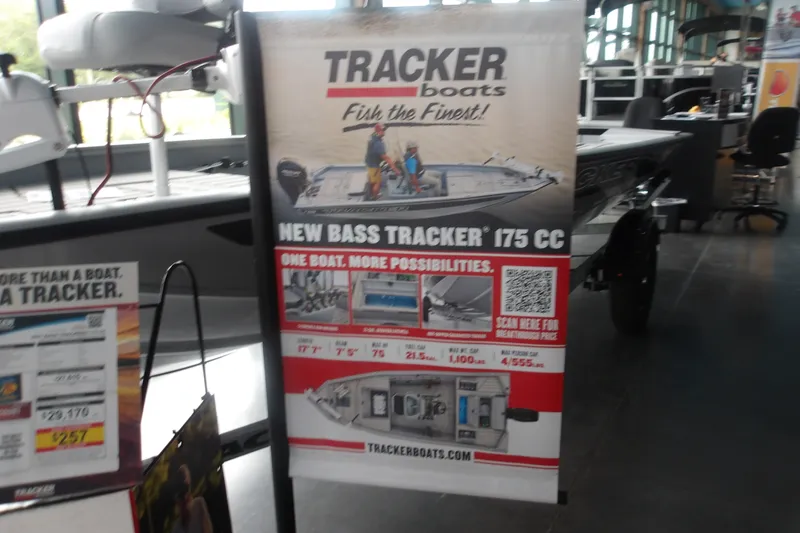The Image of Poster showcasing the 2027 Tracker Bass Tracker 175 CC boat in a showroom. - 0