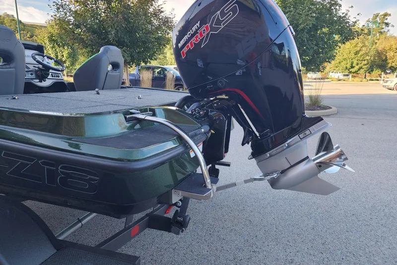 Slide: The Image of 2027 Nitro Z18 XL Pro boat with Mercury Pro XS engine in a parking lot. - 8