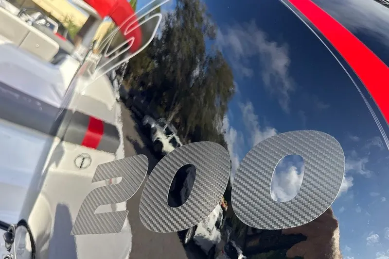 Slide: The Image of Close-up of Tahoe T21 2027 boat with "200" carbon fiber decal. - 2