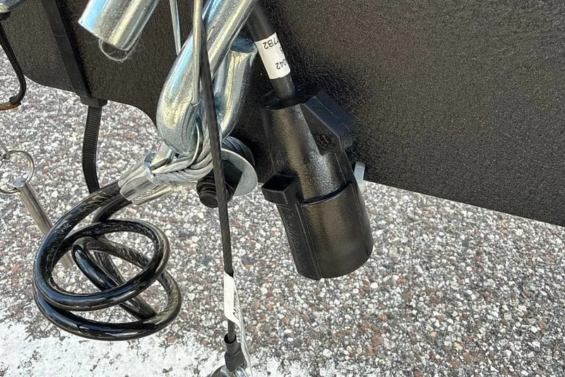 Slide: The Image of Trailer hitch and wiring connector on a 2027 Tahoe T21 vehicle. - 95