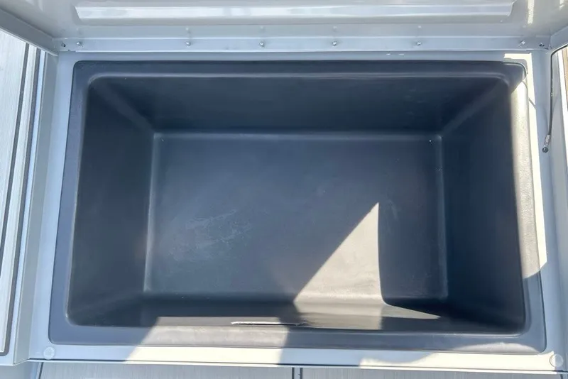 Slide: The Image of Open storage compartment in 2027 Tracker Bass Tracker 175 CC boat. - 13