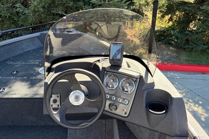 Slide: The Image of Steering console of 2027 Tracker Pro Guide V-16 SC boat with gauges and GPS device. - 20
