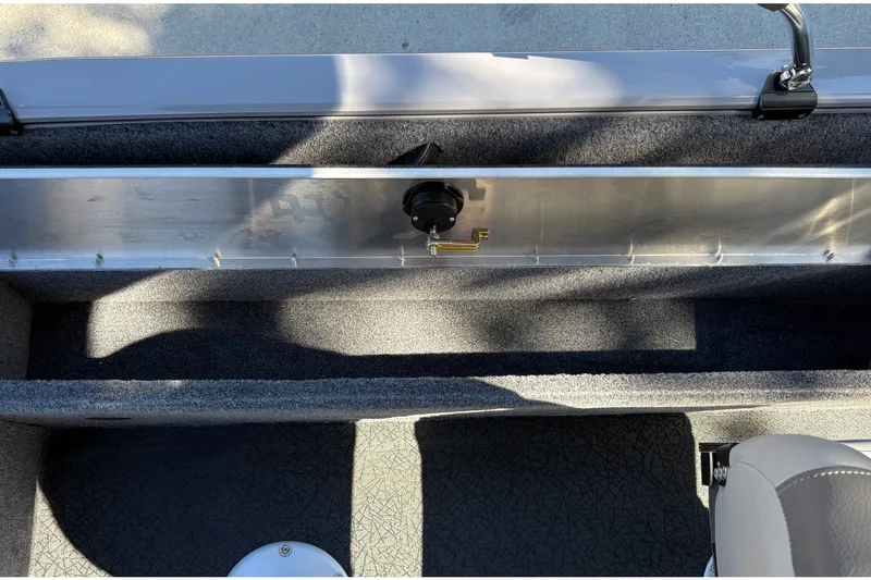 Slide: The Image of Interior view of 2027 Tracker Pro Guide V-16 SC boat, showcasing storage compartment. - 32
