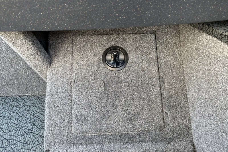 Slide: The Image of Carpeted storage compartment in 2027 Tracker Pro Guide V-16 SC boat interior. - 38