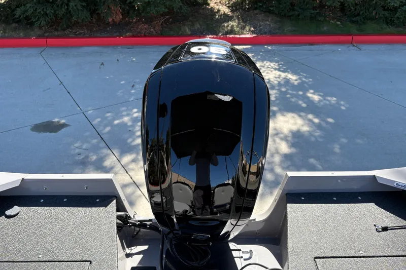 Slide: The Image of 2027 Tracker Pro Guide V-16 SC boat with a powerful outboard motor. - 14