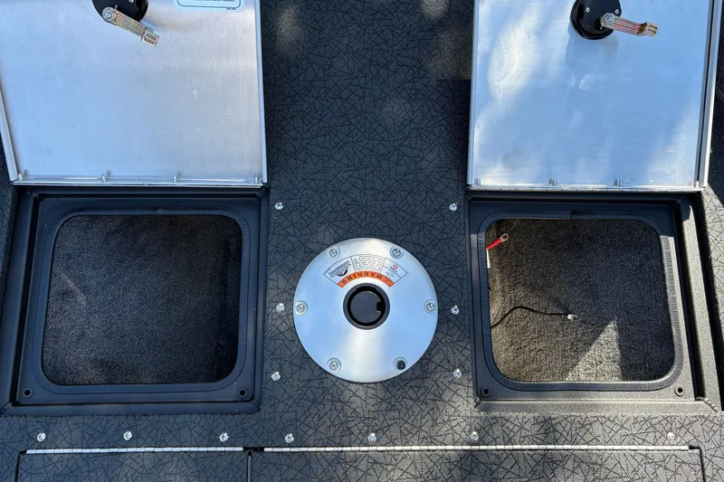 Slide: The Image of 2027 Tracker Pro Guide V-16 SC boat deck with storage compartments and seat base. - 41