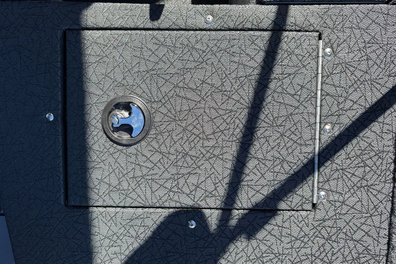 Slide: The Image of 2027 Tracker Pro Guide V-16 SC boat hatch with textured surface and metal latch. - 28