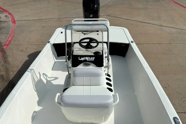 Slide: The Image of 2027 Mako Pro Skiff 17 CC boat interior with steering console and seating. - 10