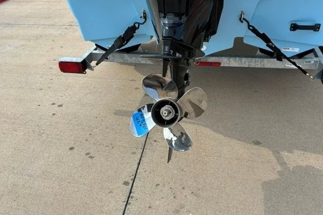 Slide: The Image of Propeller of a 2027 Mako Pro Skiff 17 CC boat on a trailer. - 15