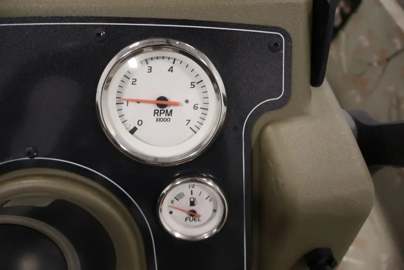 Slide: The Image of Dashboard of 2024 Tracker Grizzly 1860 MVX CC with RPM and fuel gauges. - 17