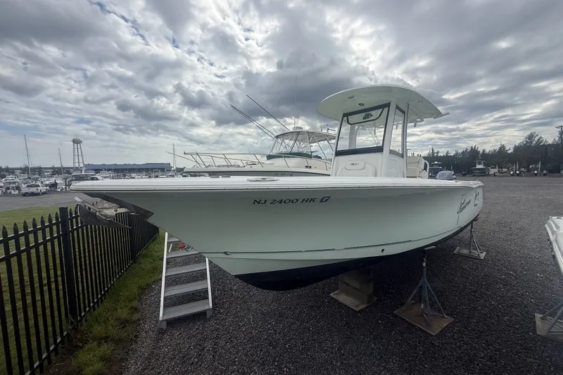 Slide: The Image of 2017 Sea Hunt Gamefish 27 boat on display in a marina setting. - 2