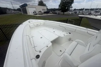 Slide: The Image of 2017 Sea Hunt Gamefish 27 boat interior with seating and storage compartments. - 11
