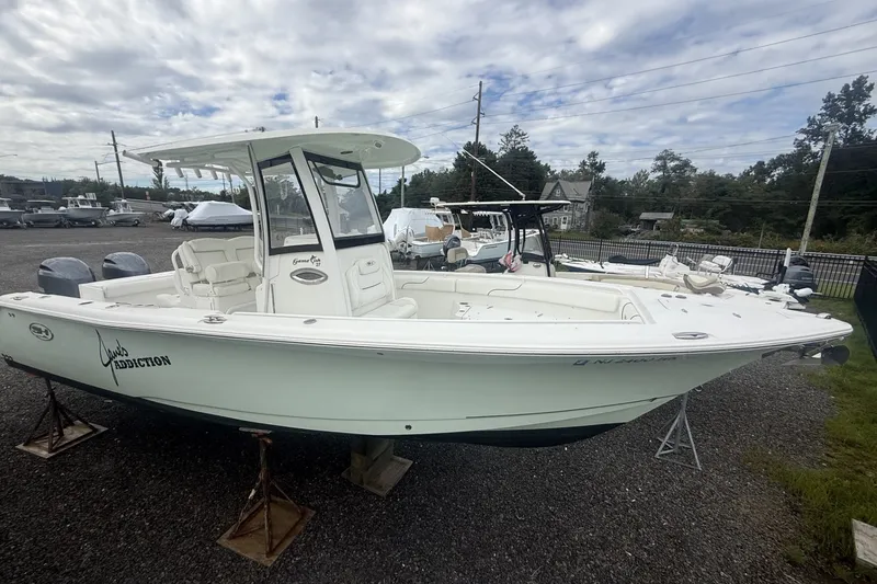 Slide: The Image of 2017 Sea Hunt Gamefish 27 boat on display in a marina setting. - 3