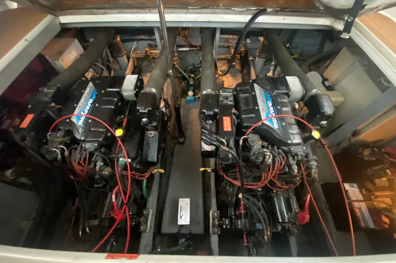 Slide: The Image of Engine compartment of a 1997 Sea Ray Sundancer 400 with dual MerCruiser engines. - 71
