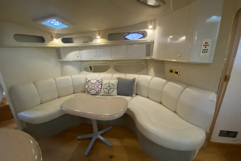 Slide: The Image of Luxurious interior of a 1997 Sea Ray 40 Sundancer yacht with plush seating and elegant decor. - 16
