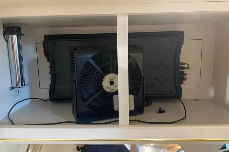Slide: The Image of Electrical components inside a 1997 Sea Ray 40 Sundancer boat compartment. - 25