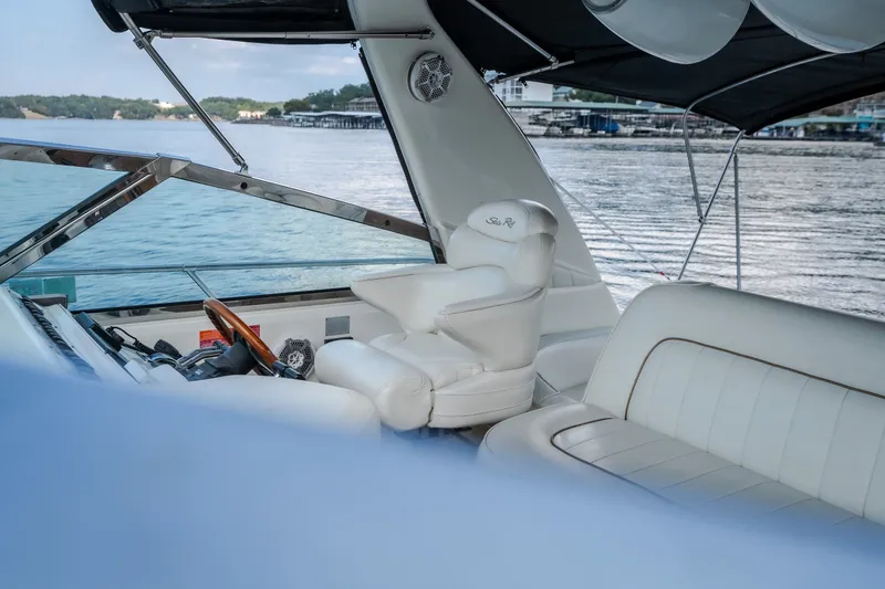 Slide: The Image of Luxurious 1997 Sea Ray Sundancer 400 yacht interior with white leather seating by the water. - 33