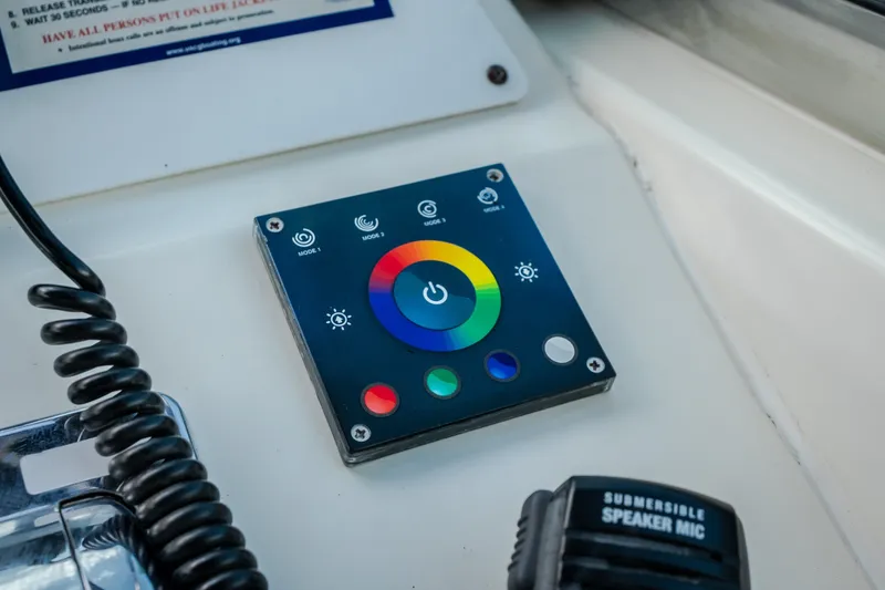 Slide: The Image of Control panel on 1997 Sea Ray Sundancer 400 boat with colorful interface and speaker mic. - 26