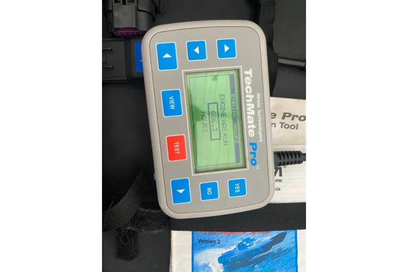 Slide: The Image of TechMate Pro diagnostic tool displaying engine hours for 1997 Sea Ray 40 Sundancer. - 36