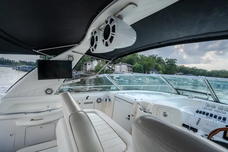 Slide: The Image of Interior view of 1997 Sea Ray Sundancer 400 yacht with luxurious seating and modern controls. - 13