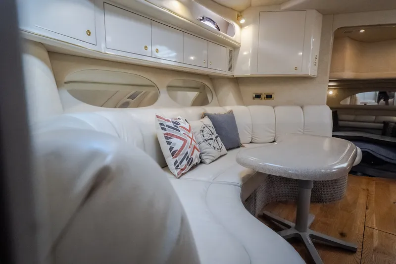 Slide: The Image of Luxurious interior of a 1997 Sea Ray Sundancer 400 yacht with plush seating and elegant decor. - 57