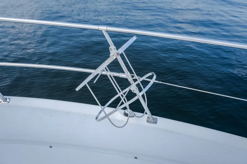 Slide: The Image of Stainless steel railing on 1997 Sea Ray Sundancer 400 yacht, overlooking calm blue water. - 27