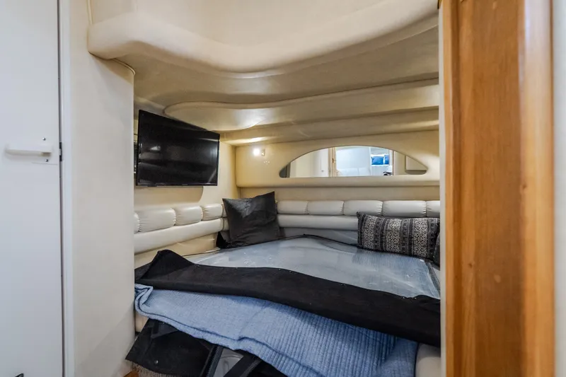 Slide: The Image of Interior cabin of 1997 Sea Ray Sundancer 400 with cozy seating and TV. - 46