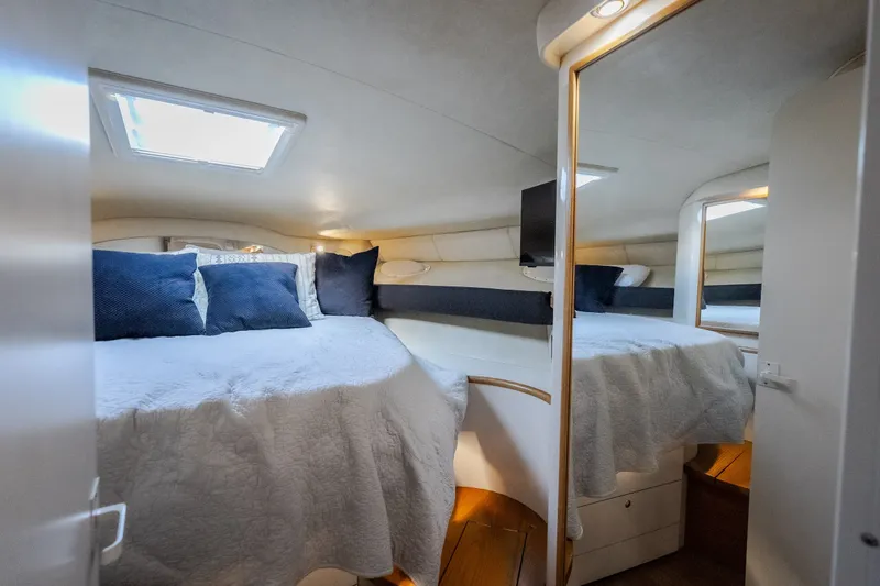 Slide: The Image of Luxurious cabin interior of a 1997 Sea Ray Sundancer 400 yacht with cozy bedding. - 53