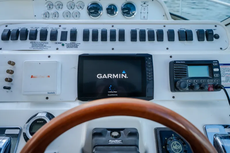 Slide: The Image of Control panel of a 1997 Sea Ray Sundancer 400 with Garmin navigation system. - 10
