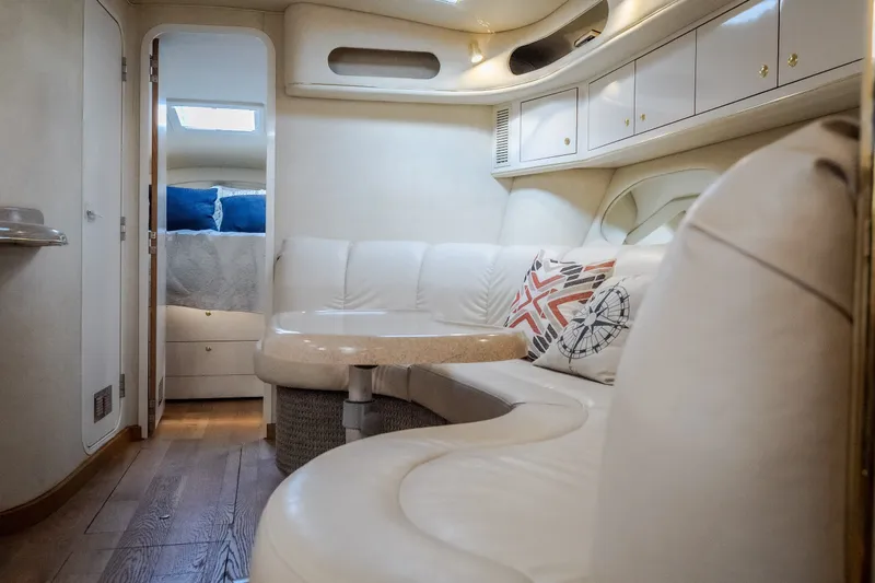 Slide: The Image of Luxurious interior of a 1997 Sea Ray Sundancer 400 yacht with plush seating and elegant decor. - 51