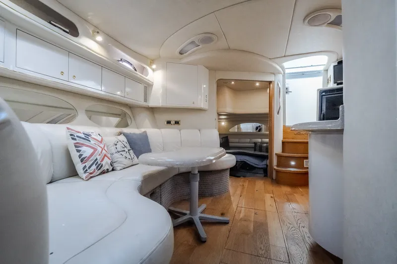 Slide: The Image of Luxurious interior of a 1997 Sea Ray Sundancer 400 yacht with elegant seating and wooden flooring. - 56