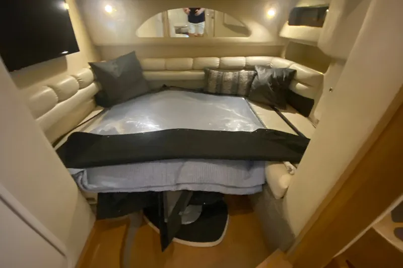 Slide: The Image of Interior cabin of a 1997 Sea Ray 40 Sundancer yacht with cozy seating and bedding. - 34