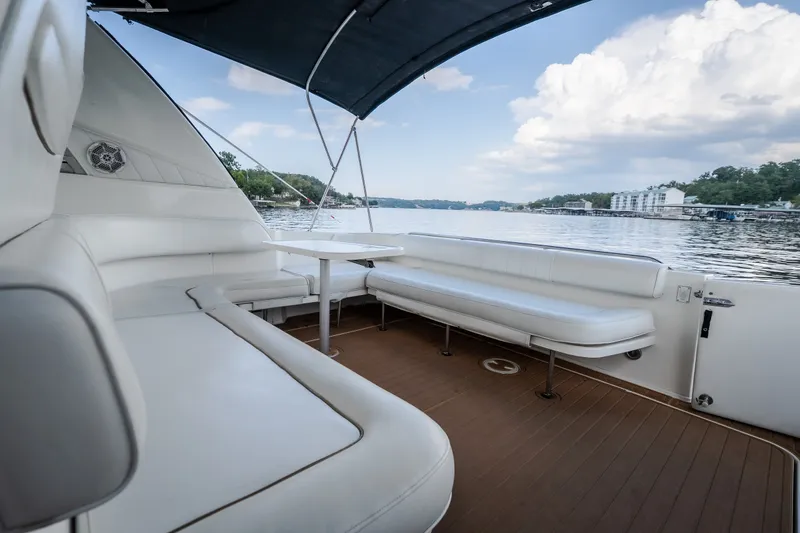 Slide: The Image of Spacious deck of 1997 Sea Ray Sundancer 400 yacht with scenic water view. - 16