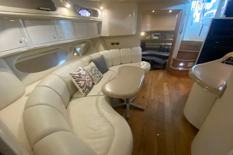 Slide: The Image of Luxurious interior of a 1997 Sea Ray 40 Sundancer yacht with plush seating and elegant design. - 22