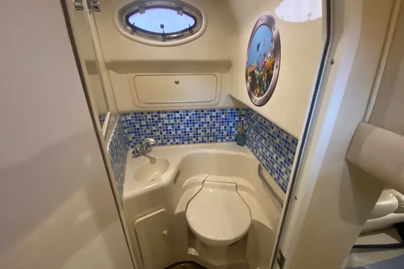 Slide: The Image of Bathroom interior of 1997 Sea Ray 40 Sundancer yacht with blue mosaic tiles. - 35
