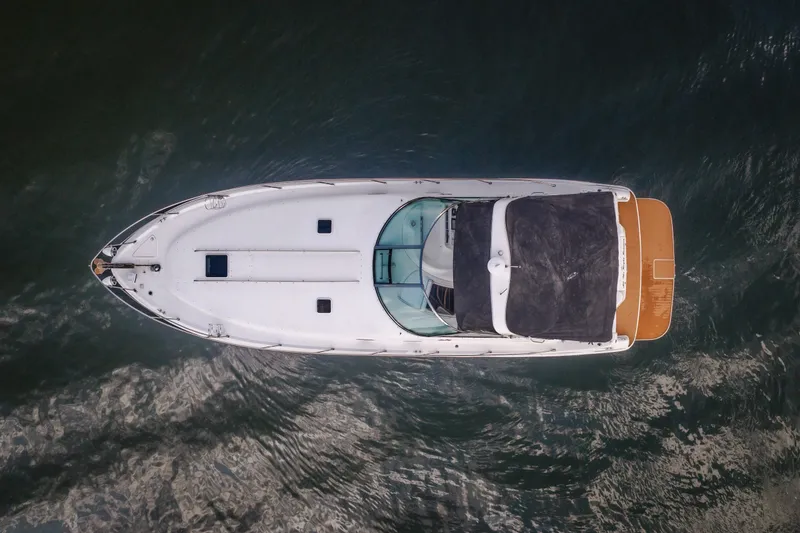 Slide: The Image of Aerial view of 1997 Sea Ray Sundancer 400 yacht on water. - 5
