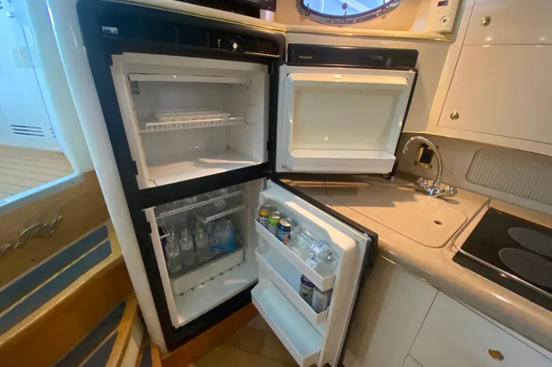 Slide: The Image of Open refrigerator in 1997 Sea Ray 40 Sundancer yacht kitchen, stocked with drinks. - 32