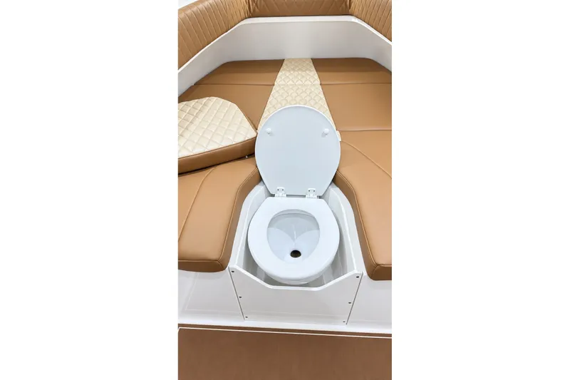 Slide: The Image of 2008 Grady-White Express 330 boat interior with open toilet seat and cushioned seating. - 48