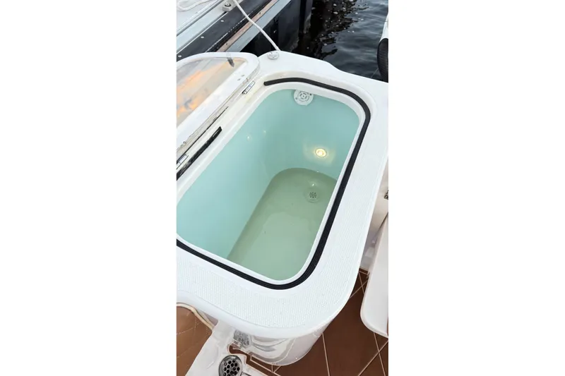 Slide: The Image of Livewell on 2008 Grady-White Express 330 boat, open lid, dockside view. - 58