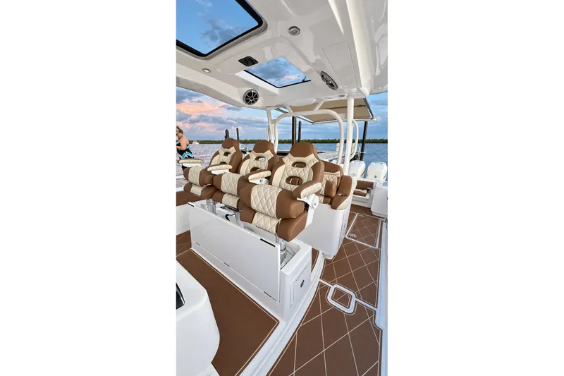 Slide: The Image of Luxurious interior of 2008 Grady-White Express 330 boat with plush seating and scenic view. - 26