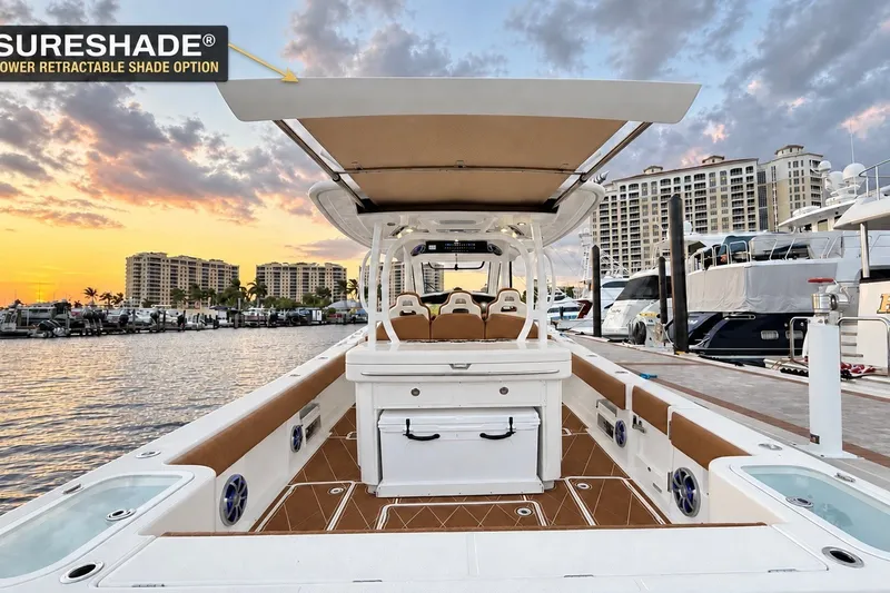 Slide: The Image of 2008 Grady-White Express 330 boat with SureShade, docked at sunset. - 23